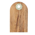 Wooden cutting board with a decorative ring on a white background