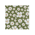 Floral patterned fabric with white flowers on a green background