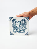 jones & co taverna occy wall art, blue and white octopus on hand-painted capiz shell tile