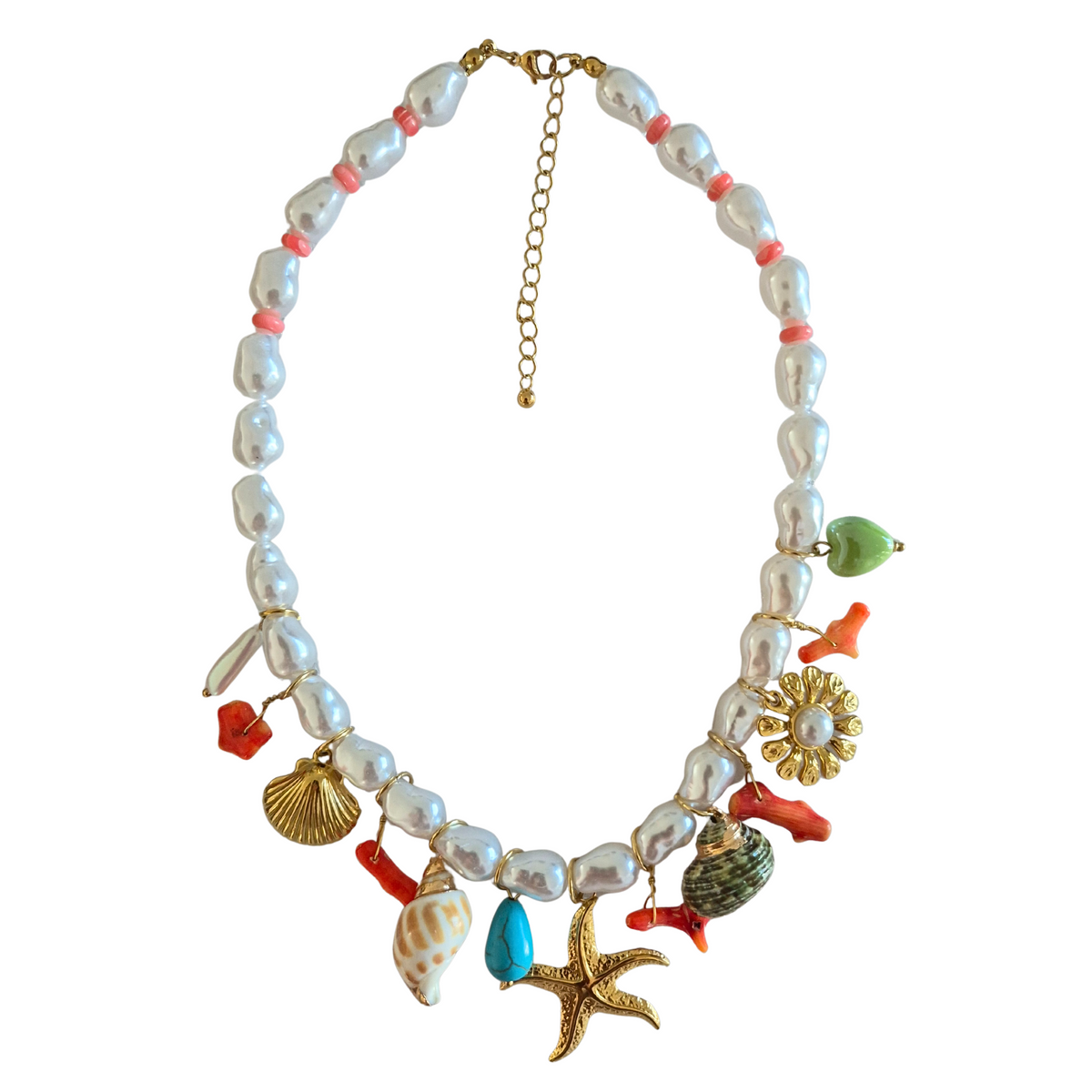 zoda pearl charm necklace with starfish shell and coral charms on white background