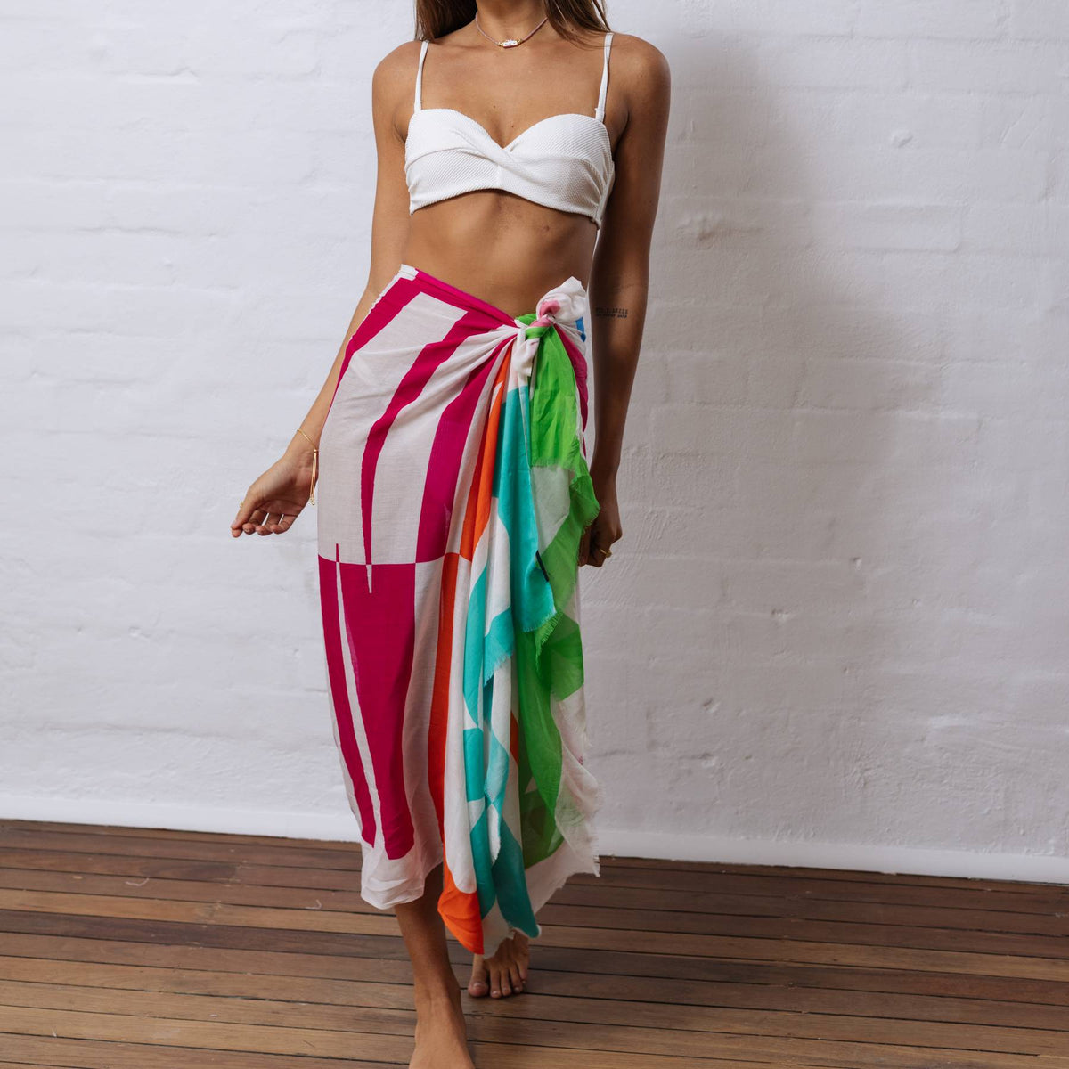 zoda colourful striped sarong scarf worn as beach wrap skirt by model